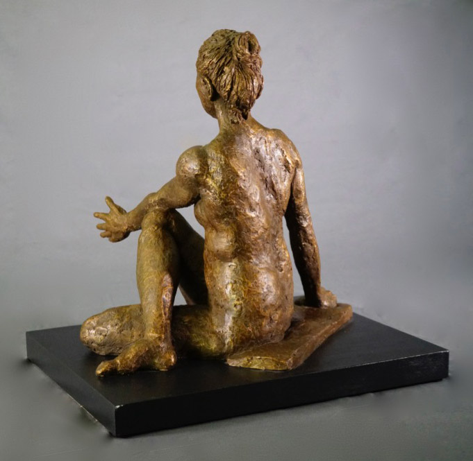 Female in seated and twisted Lord of the Fishes yoga pose in cast resin rear view by William Casper.