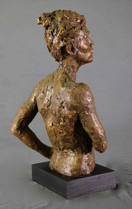 Female waist high with right arm crossed rear view in cast resin by William Casper.