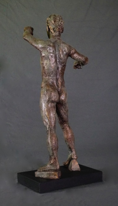 Standing male with clenched hands rear view in cast resin by William Casper.
